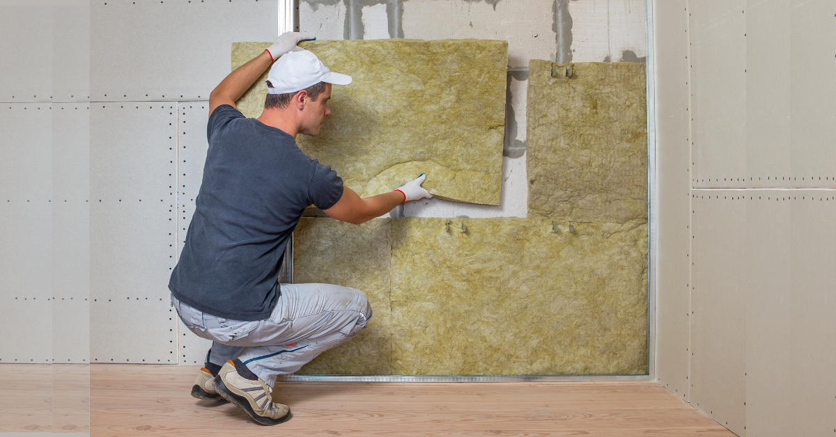 Installing insulation inside the walls of a mobile home